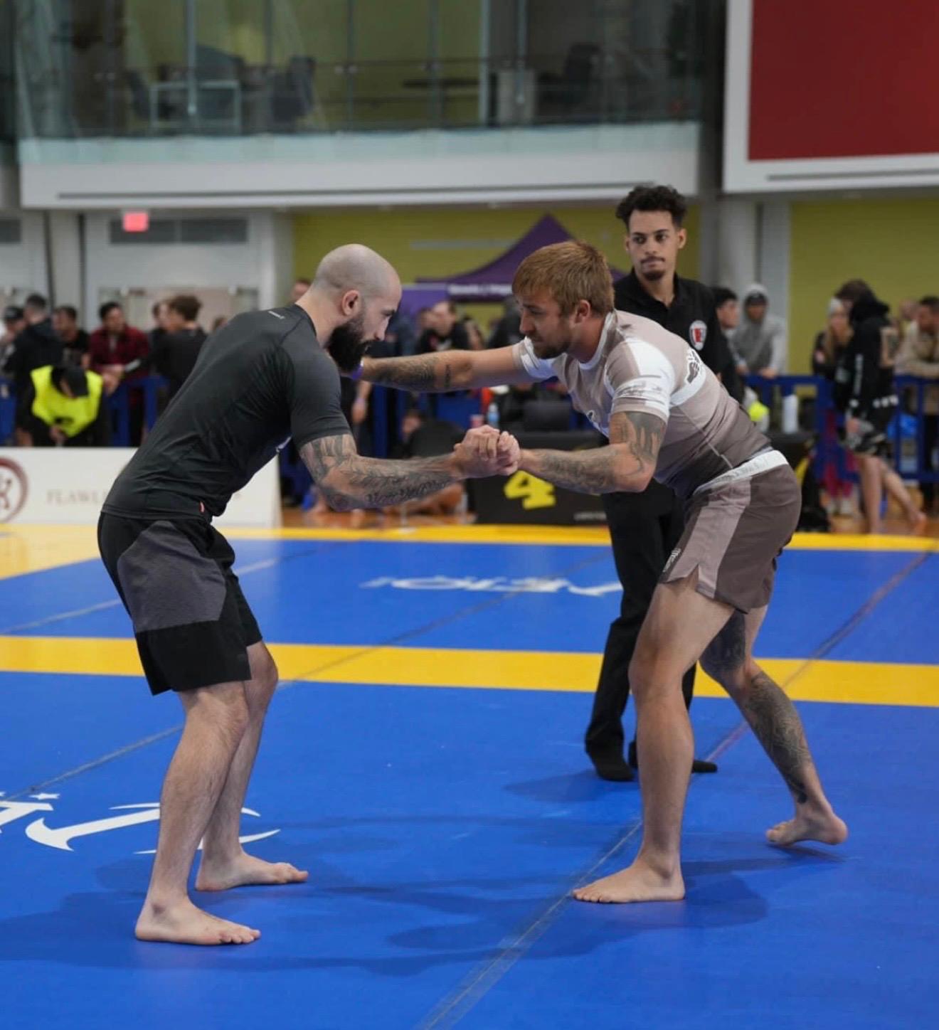 Cody MacCharles Standing No-Gi Grappling Professor Cody MacCharles hand-fighting with an opponent during a no-gi Brazilian Jiu-Jitsu match.