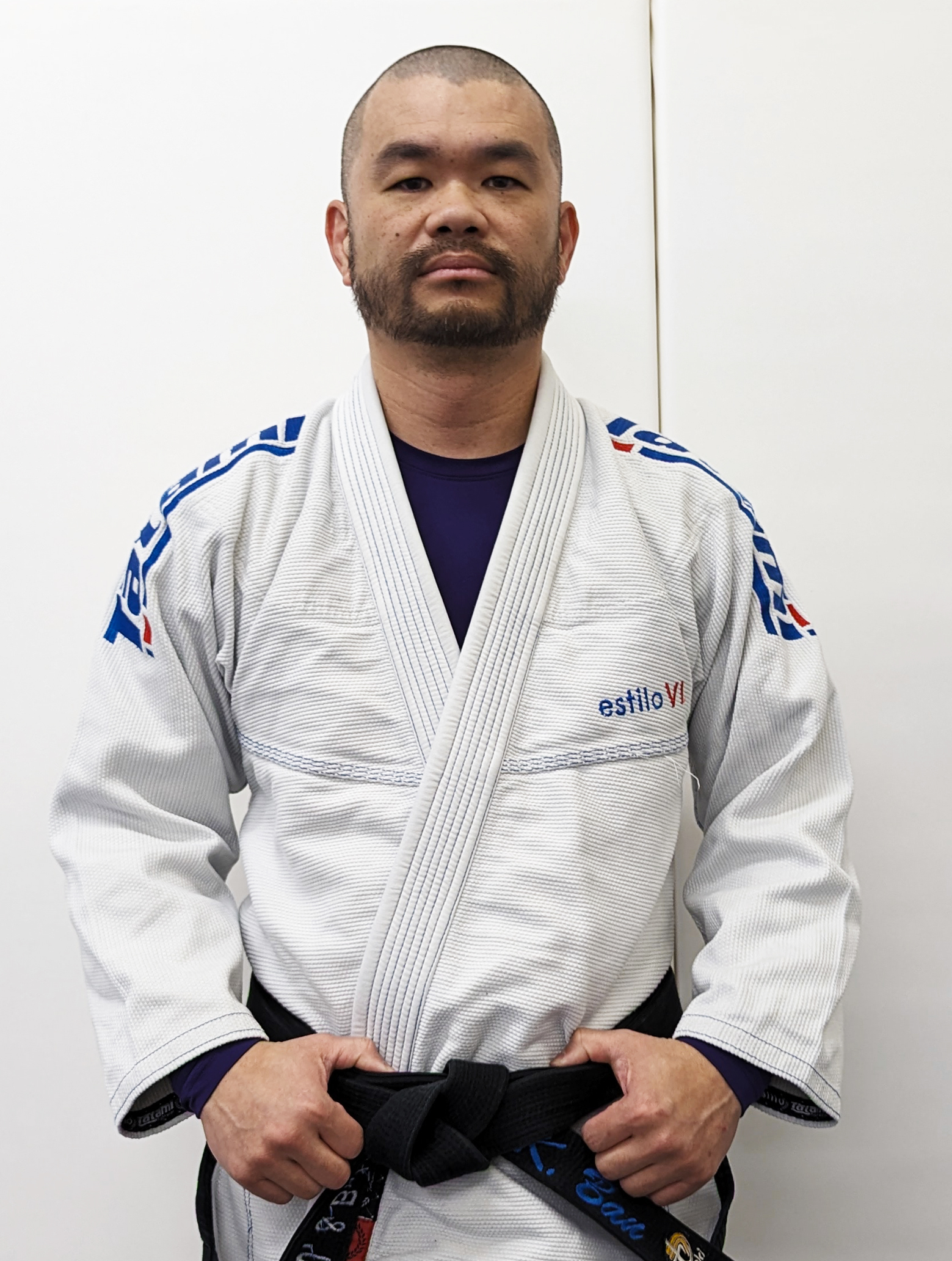 Sensei Kevin wearing a white Judo gi and black belt for his True North Martial Arts coaching profile.