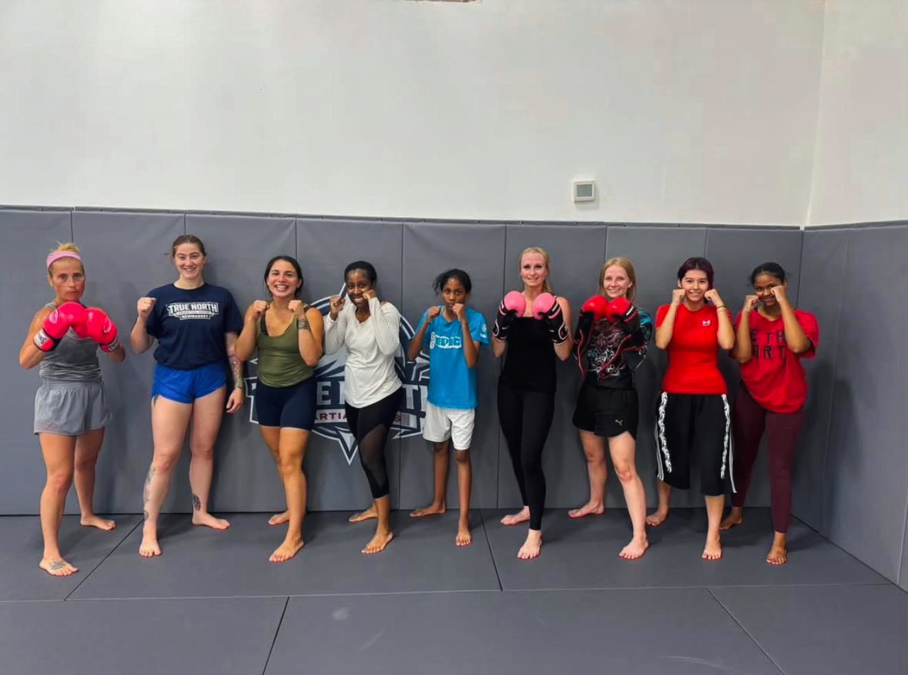 Women’s kickboxing class participants training together at True North Martial Arts in Newmarket, Ontario.